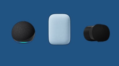 Amazon Echo, Google Audio, and Sonos smart speakers sit next to each other on a blue background