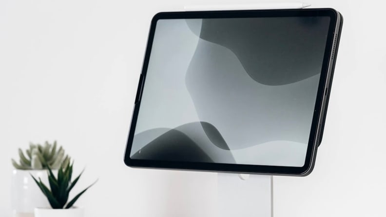 An iPad sits on an iPad stand.