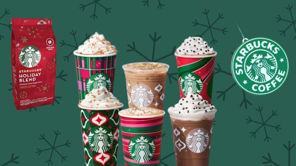Holiday cups, a Starbucks ornament, and coffee grinds on a green background