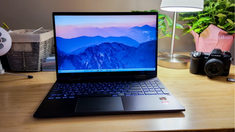 HP laptop on wooden table