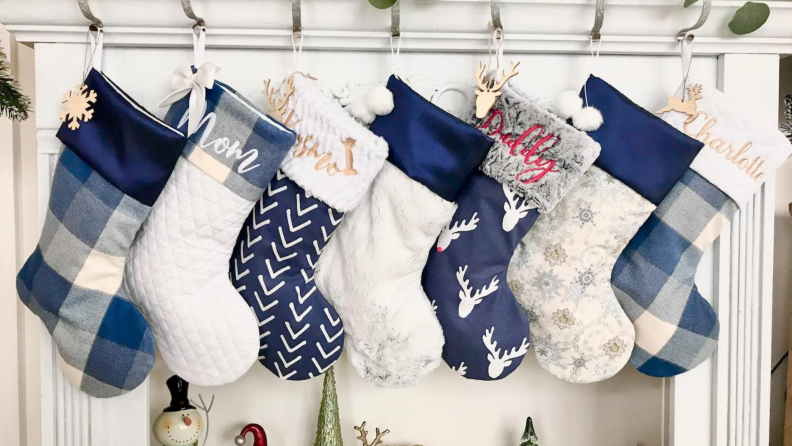 A line of blue and white Christmas stockings.