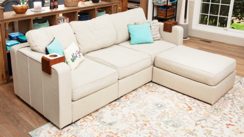 The Lovesac Sactional configured with three seats and a left-side chaise in a living room.