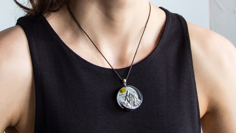 woman wearing a pendant made of resin