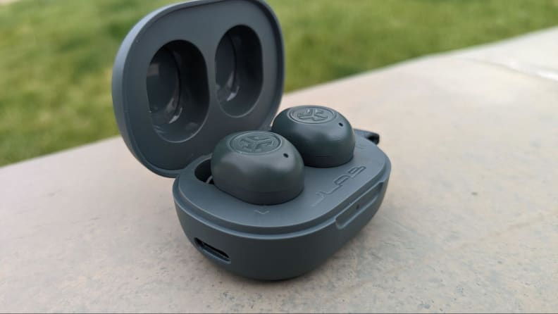 THe headphones inside their case in an outdoor setting.