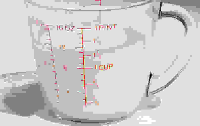 Liquid measuring cup with milk