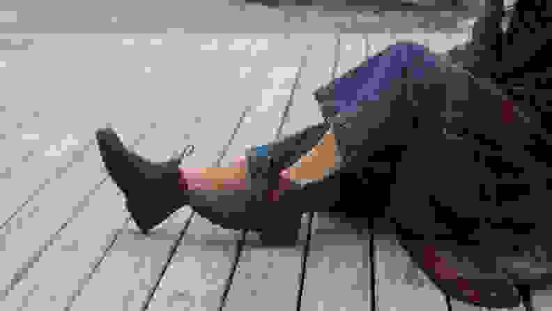 Photo of a model's legs. She wears blue jeans and Blundstone x L.L.Bean Chelsea boots.