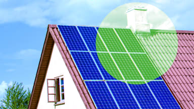 Suburban home with solar panels on roof.