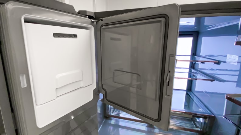 The Café CVE28DM5NBS5 French door refrigerator's ice maker.