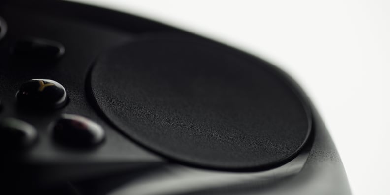 A close-up photo of the Valve Steam Controller's right touchpad.