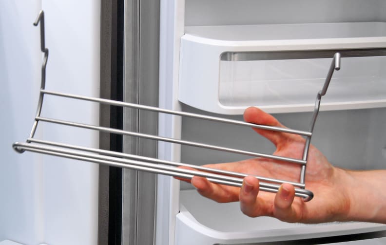 The KitchenAid KFXS25RYMS comes with a bottle rack, but there's no clear indication of what exactly it hooks on to in the manual.