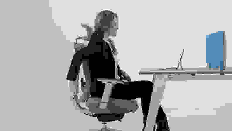 Woman sitting in desk chair