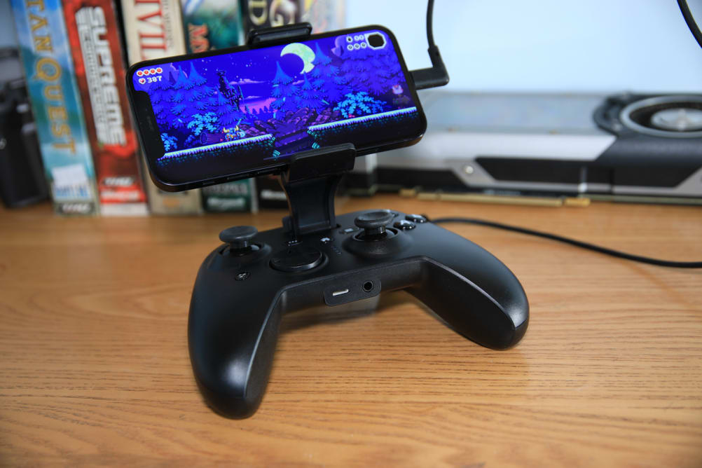 The RiotPWR Cloud Gaming Controller connected to an iOS while it plays 'The Messenger.'