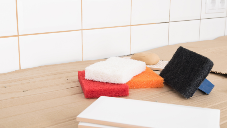 Sponges lay on a countertop.