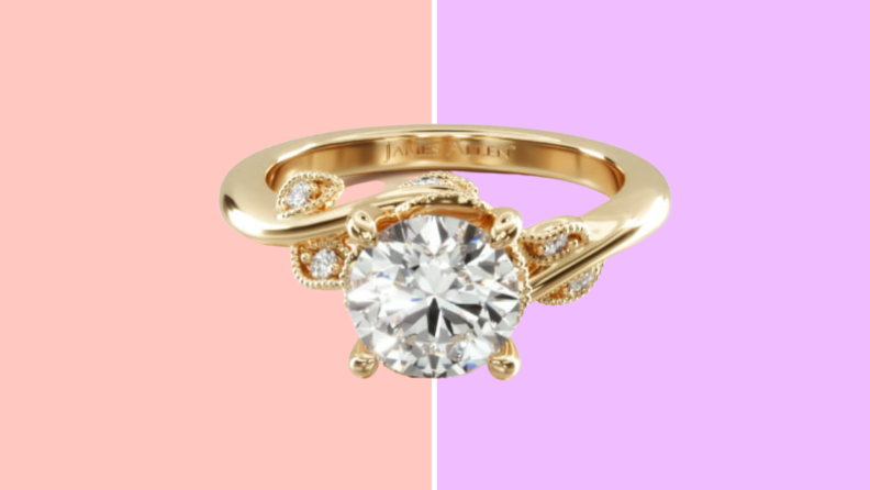 A gold ring with vine shaped band and a round diamond.