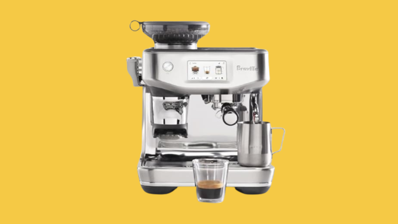 Photo of a Breville espresso machine on a yellow background.
