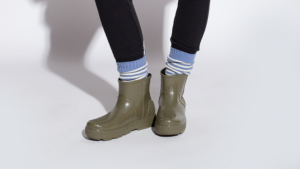 Dark green rain boots with blue socks