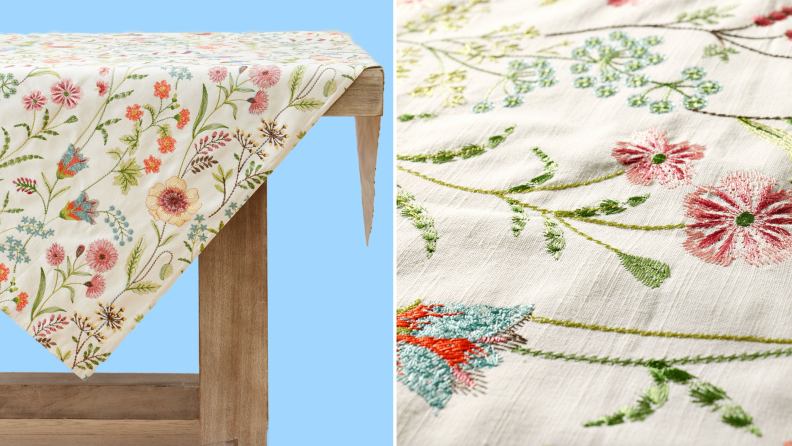 Product shot of multi-colored floral embroidered tablecloth.