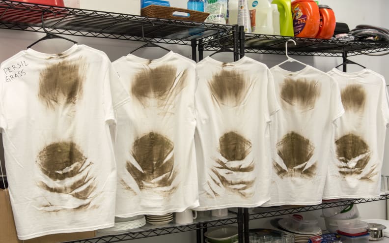 Grass- and dirt-stained T-shirts lined up