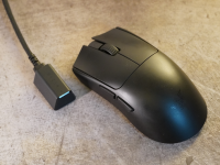 The Razer Viper V3 Pro, a black symmetrical mouse and the USB-C hyperpolling dongle