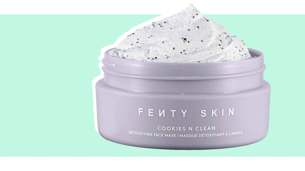 A jar of Fenty Skin Cookies and Clean face mask on an aqua background.