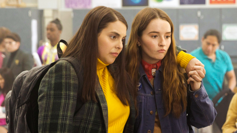 Actresses Bernie Feldstein and Kaitlyn Dever embrace in the high-school comedy Booksmart.