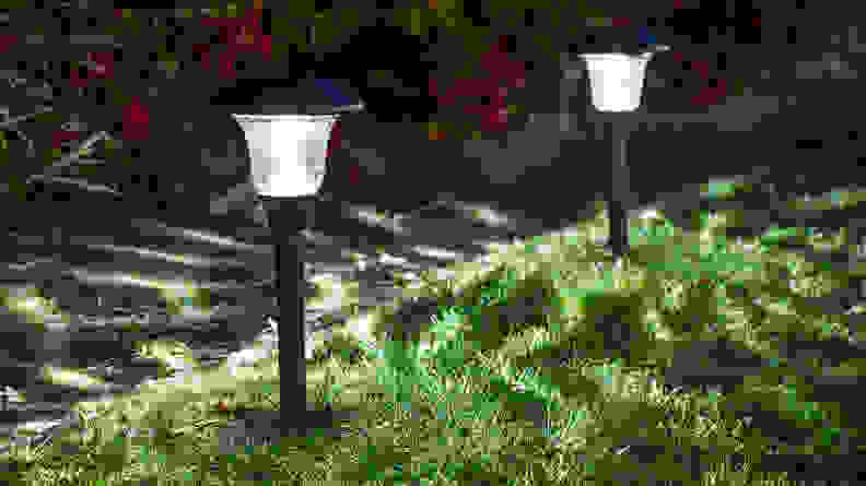 Small solar garden light, lanterns in flower beds, garden design, solar powered lamp
