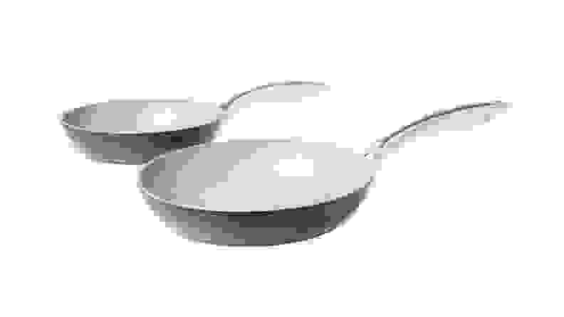 A set of two nonstick frying pans on a white background.