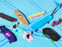 An assortment of beginner and kids' skateboards on a turquoise background