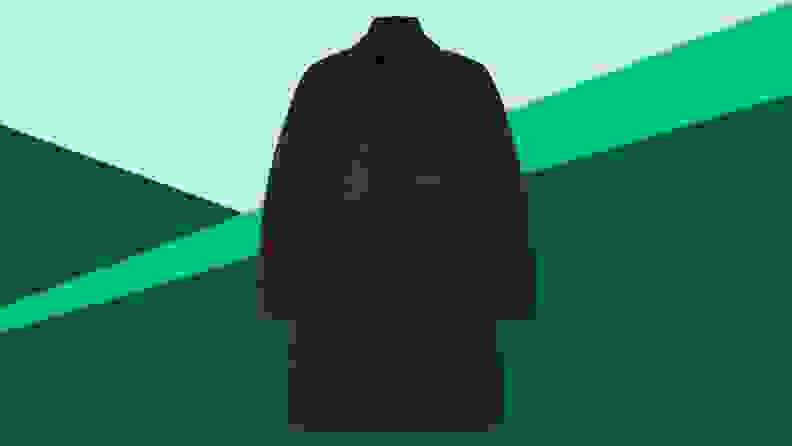 A black overcoat against a green background.