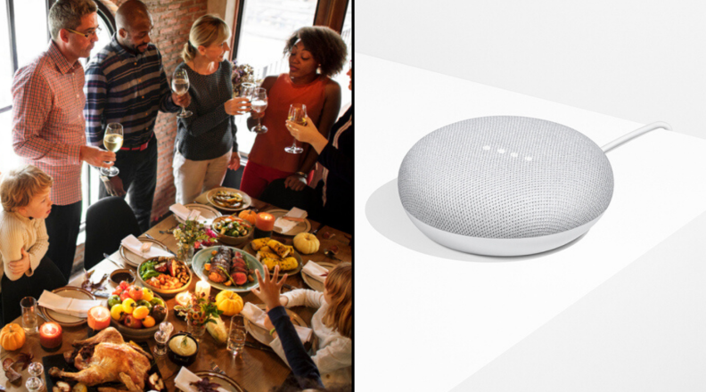 People standing around table of food and Google Home Mini