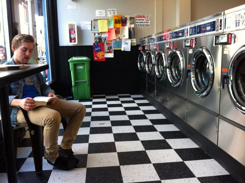 Man sitting in a laundromat