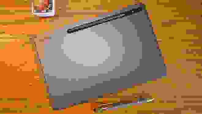 Gray laptop on a wooden surface
