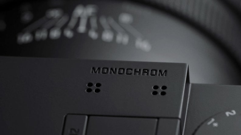 A close up of an engraved word on the top of a camera