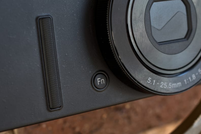 A photograph of the Nikon Coolpix P340's function button.