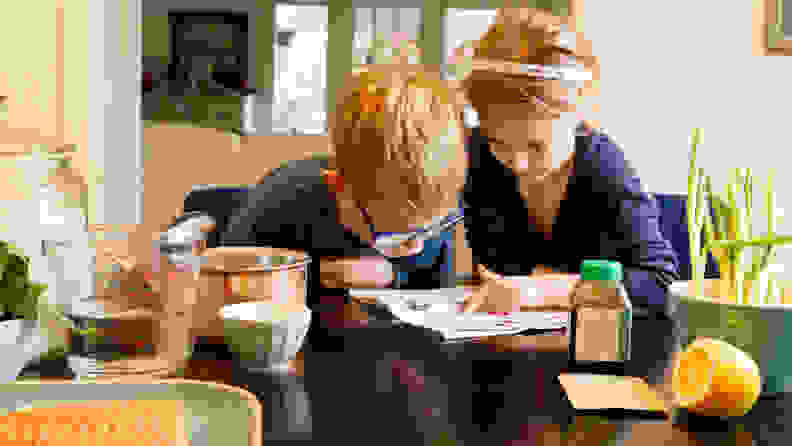 Boy and girl reading recipe.