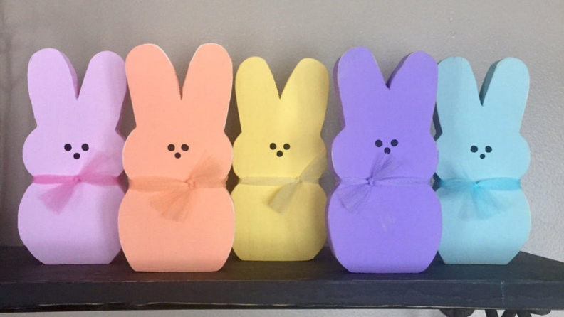 Five colorful wooden bunnies