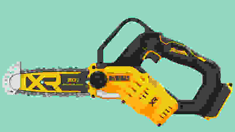 A close-up of the DCCS623B Dewalt mini chainsaw floating above a seafoam green background.