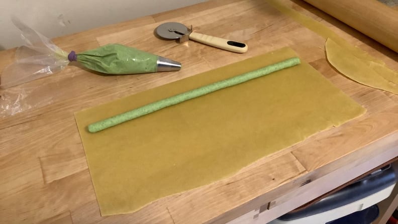 Pasta Agnolotti with Peas and Bacon being filled