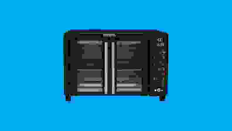 A Gourmia toaster oven against a blue background.