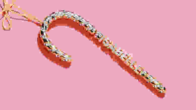 gold ornament on pink background