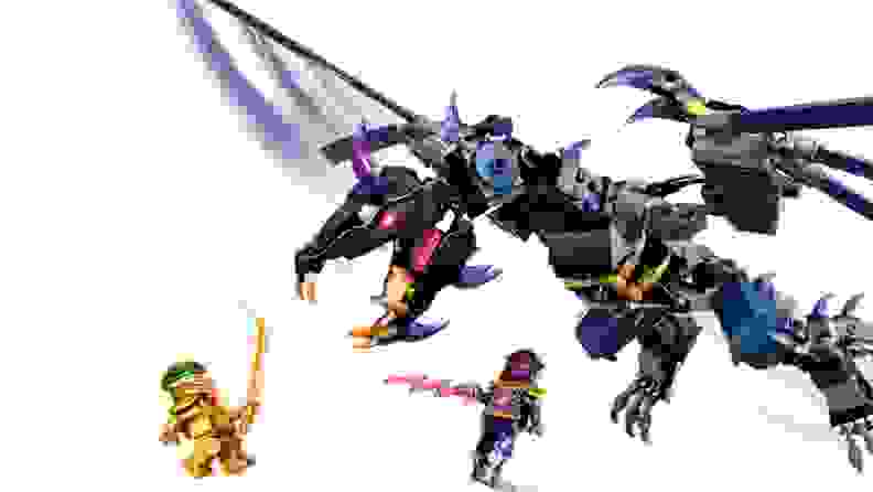 An Overloard dragon and Lego minifigures of Golden Lloyd and the Overloard