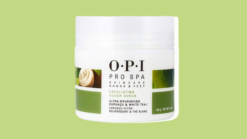 O.P.I. foot scrub in front of a light green background.