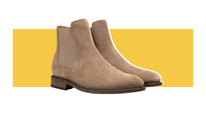 Sleek suede light brown Chelsea boots with elastic side panels.