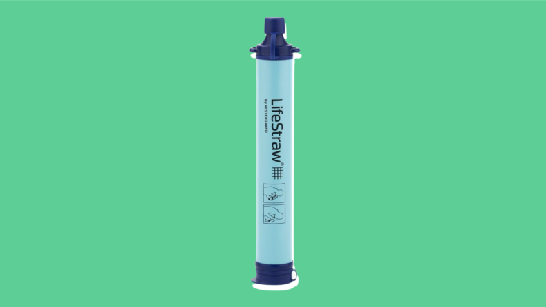 A blue and white Lifestraw on a green background.