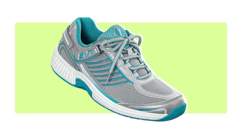 Grey and blue Verve sneakers on a light green background