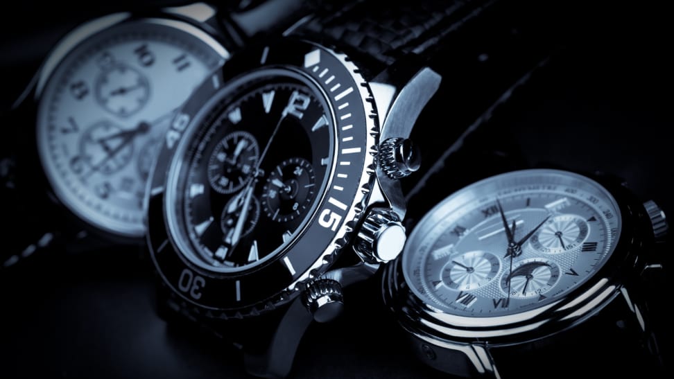 close-up of three silver wrist watches