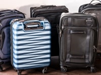 Osprey carry-on, Samsonite carry-on, and TravelPro carry-on next to each other