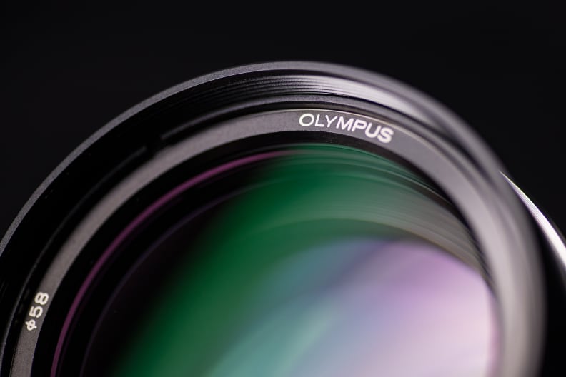 The massive front element dominates the 75mm f/1.8.