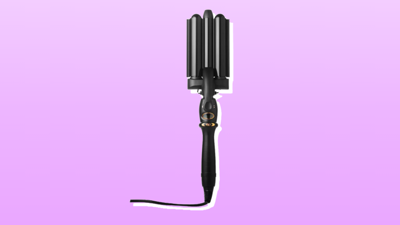 Amika hair waver in front of a purple background.