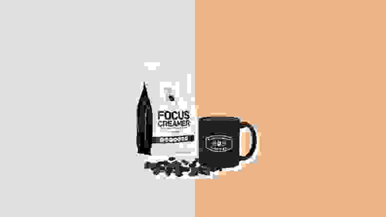 A package of Focus Creamer next to a coffee mug and a pile of coffee beans.